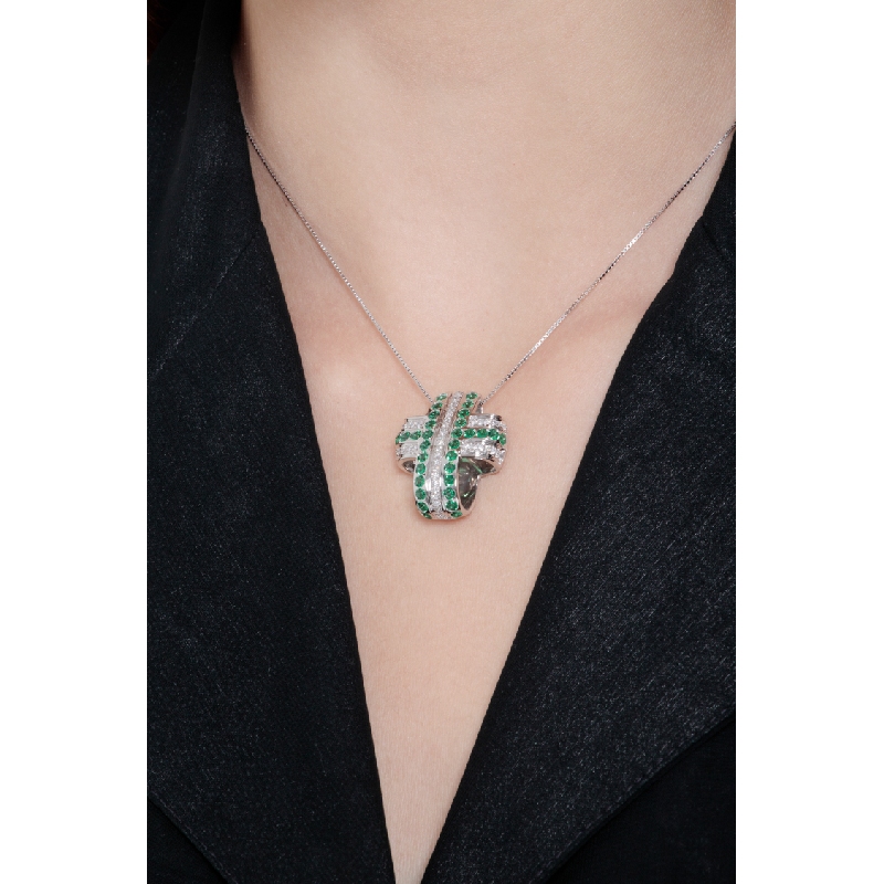Rounded cross pendant with emeralds and diamonds