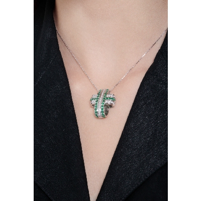 Rounded cross pendant with emeralds and diamonds