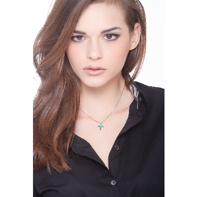 Cross pendant with 6 emeralds