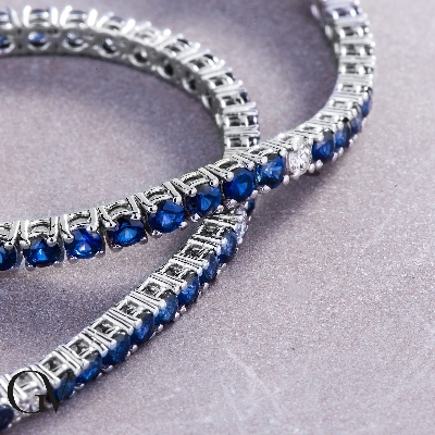 Wire style tennis bracelet with sapphires and diamonds