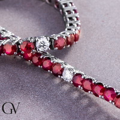 Wire style tennis bracelet with rubies and round cut diamonds