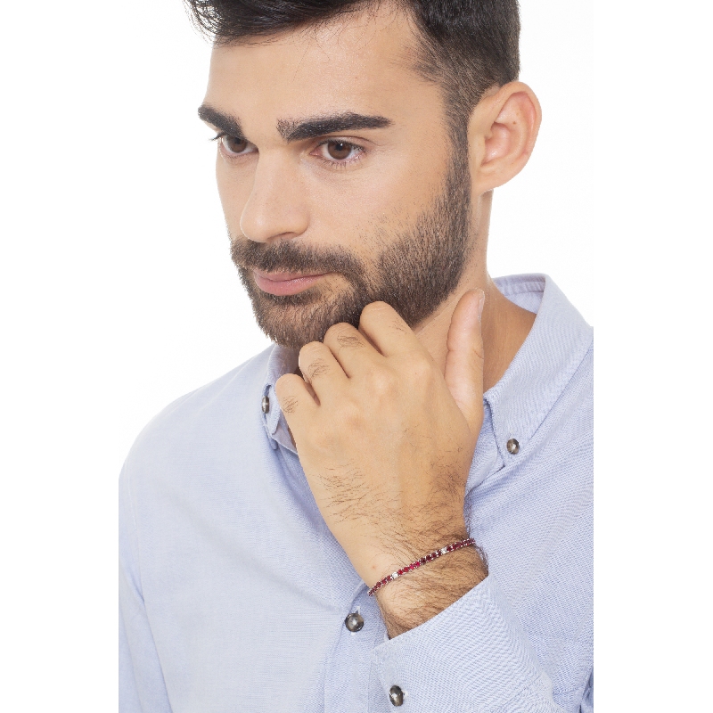 Wire style tennis bracelet with rubies and round cut diamonds