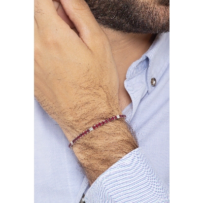 Wire style tennis bracelet with rubies and round cut diamonds