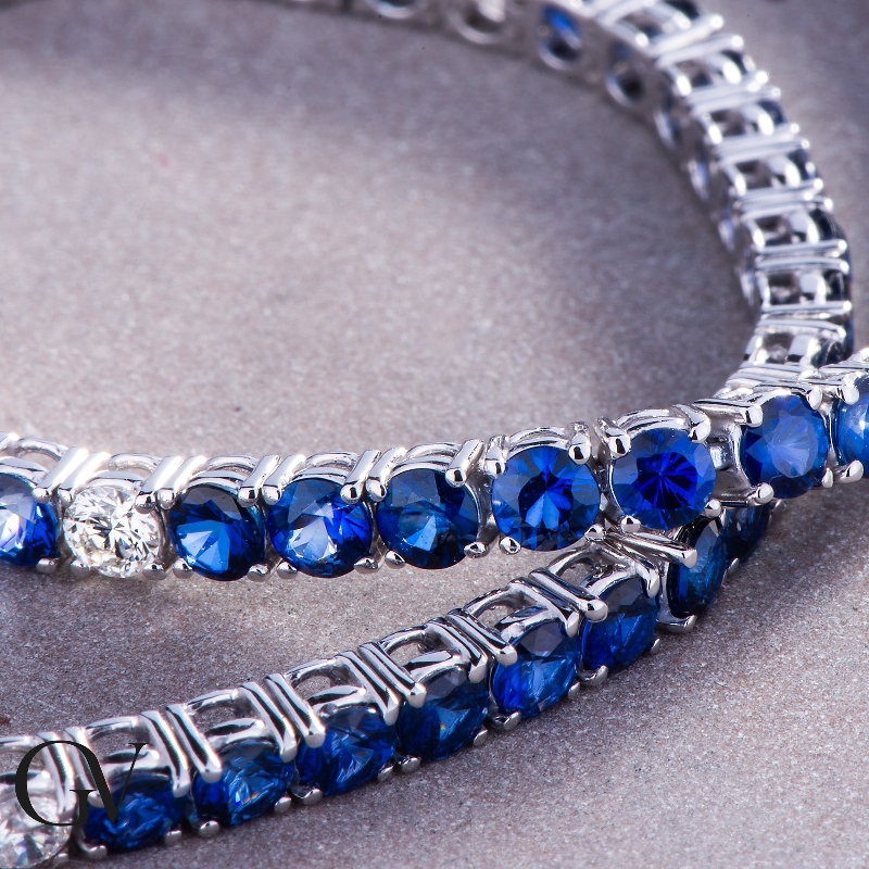 Wire style tennis bracelet with sapphires and round cut diamonds