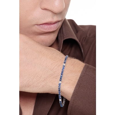 Wire style tennis bracelet with sapphires and round cut diamonds