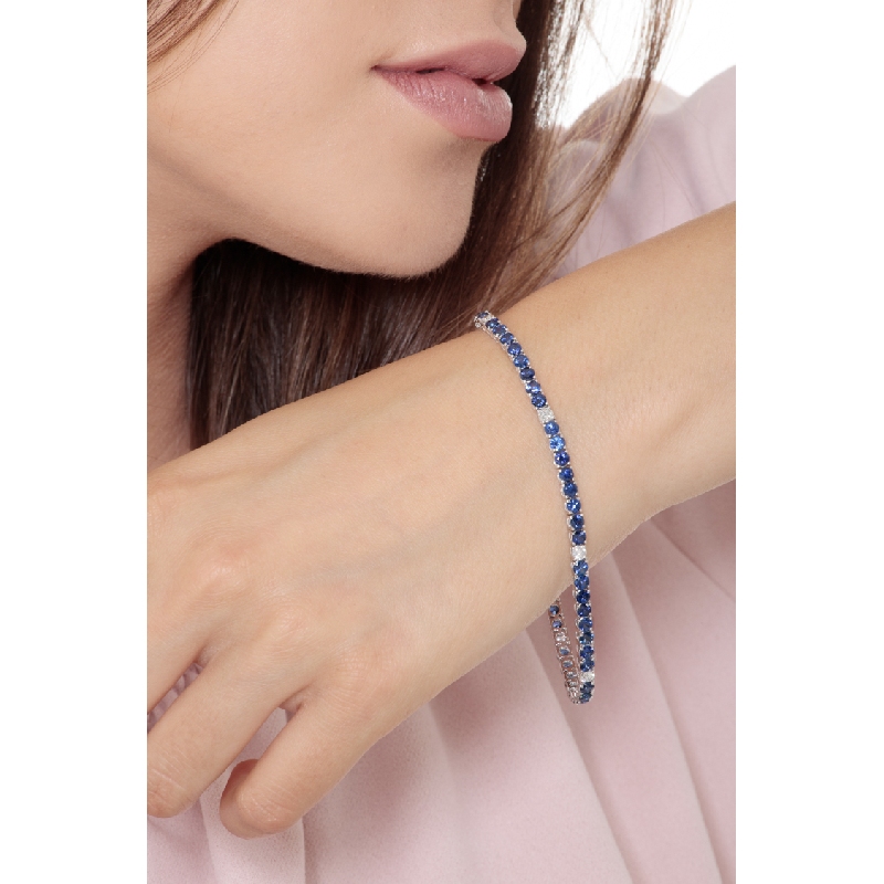 Wire style tennis bracelet with sapphires and round cut diamonds