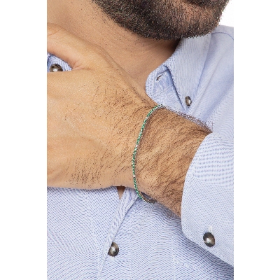 Slim tennis bracelet with emeralds and diamonds