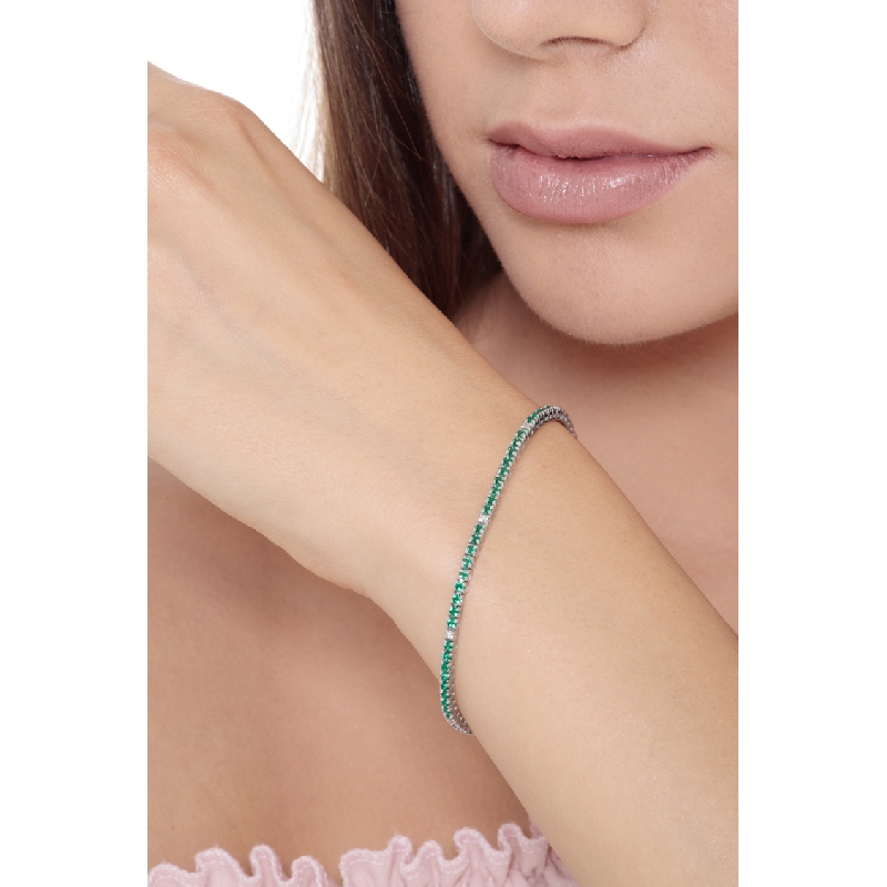 Slim tennis bracelet with emeralds and diamonds