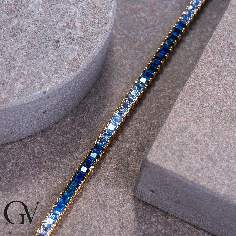 Fancy 18k yellow gold tennis bracelet with sapphire's blue shades