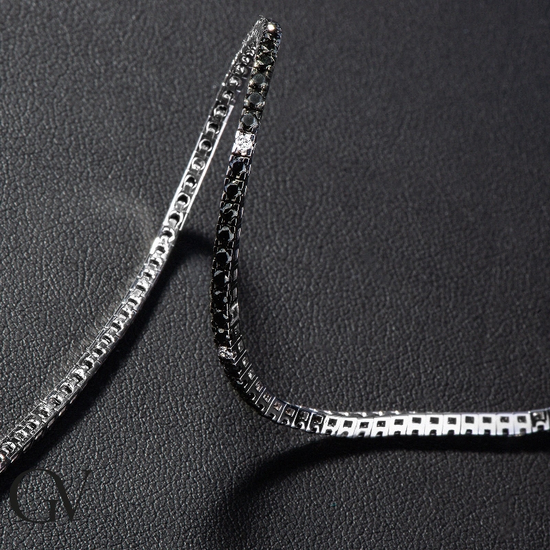18k white gold tennis bracelet with black and white diamonds and burnished tips