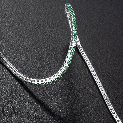 Square links tennis bracelet with round cut diamonds and emeralds