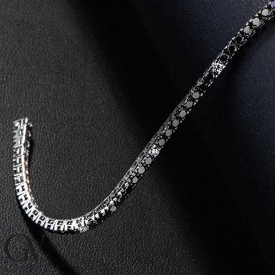 18k white gold tennis bracelet with black and white diamonds and burnished tips