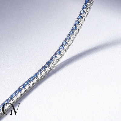 Wire style tennis bracelet with blue sapphires