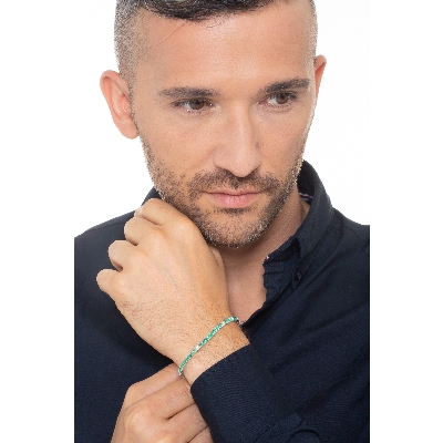 Tennis bracelet with emeralds and diamonds