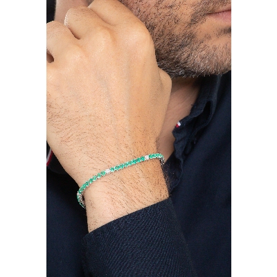 Tennis bracelet with emeralds and diamonds