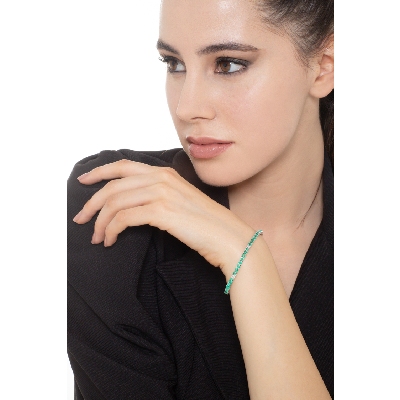 Tennis bracelet with emeralds and diamonds