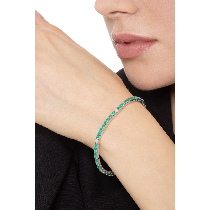 Tennis bracelet with emeralds and diamonds