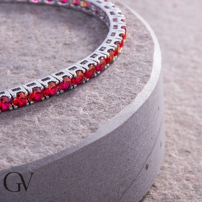 18k white gold tennis bracelet with round cut rubies