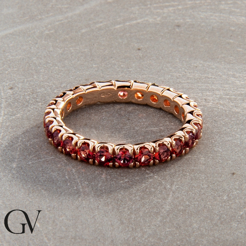18k rosé gold eternity ring with orange sapphires 