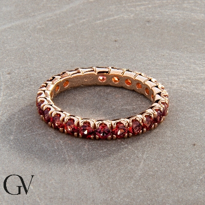18k rosé gold eternity ring with orange sapphires 