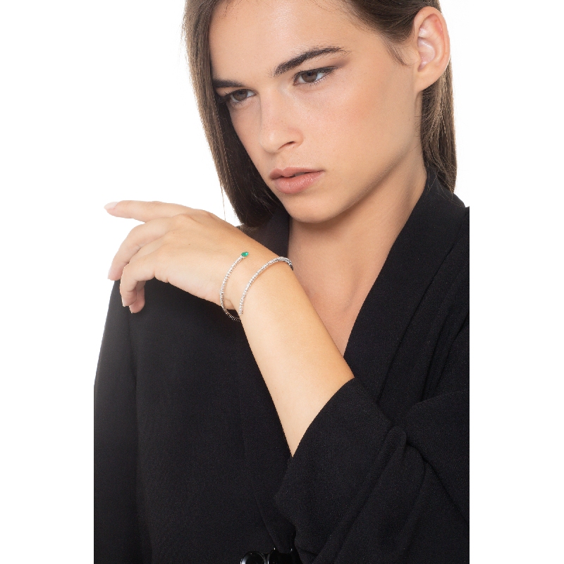 Spiral bracelet with diamonds and a drop cut emerals