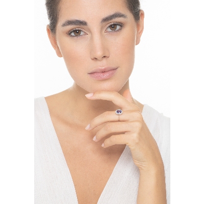 18k white gold halo ring with big central tanzanite and diamonds