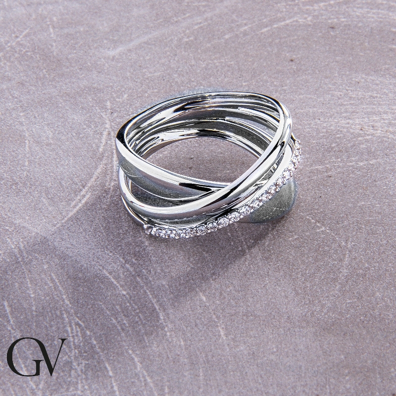 18k white gold crossover band ring with a row of diamonds 