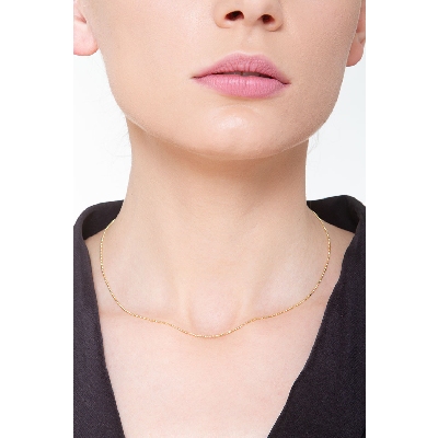 Collana con piccole palline in oro giallo 18k.