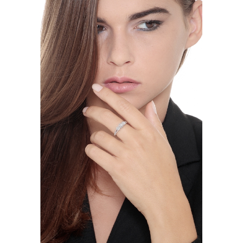 Trilogy ring with wrought shank and diamonds 