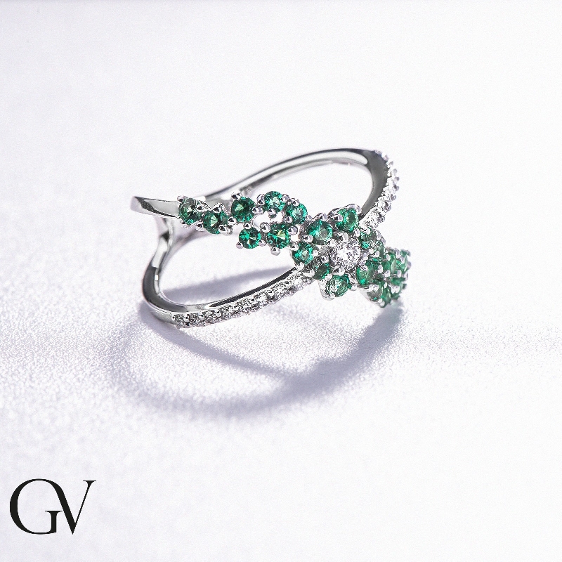 18K white gold criss cross ring with diamonds and emeralds 