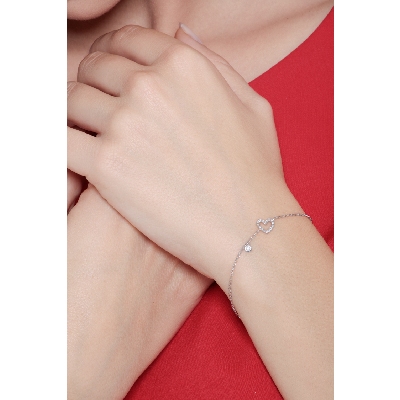 White gold 18k bracelet with diamond heart and diamond solitaire