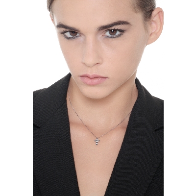 Cross pendant with black and white diamonds