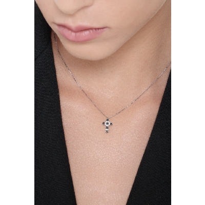Cross pendant with black and white diamonds