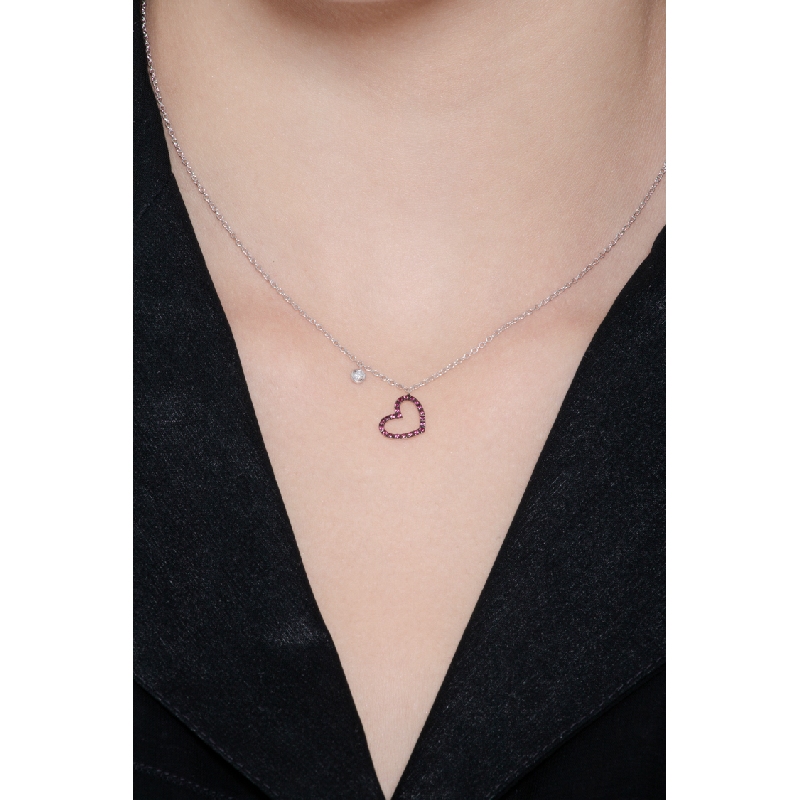 Necklace with burnished heart pendant with rubies and a solitaire diamond