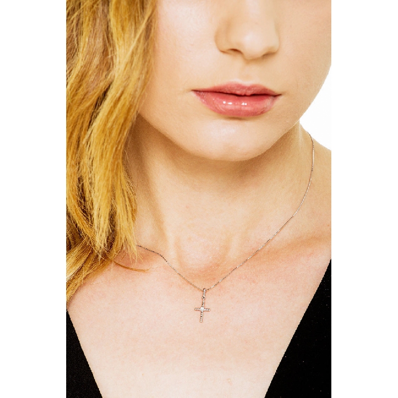 Cross pendant with solitaire diamond in 18k white gold