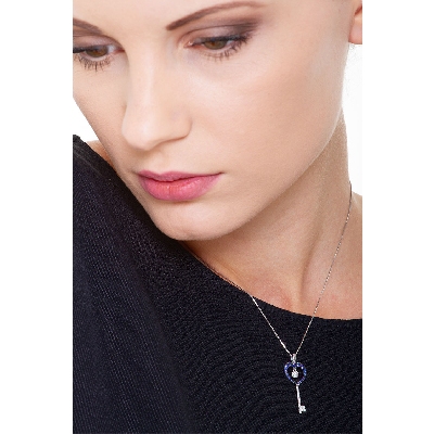 Key pendant with diamonds and blue sapphires