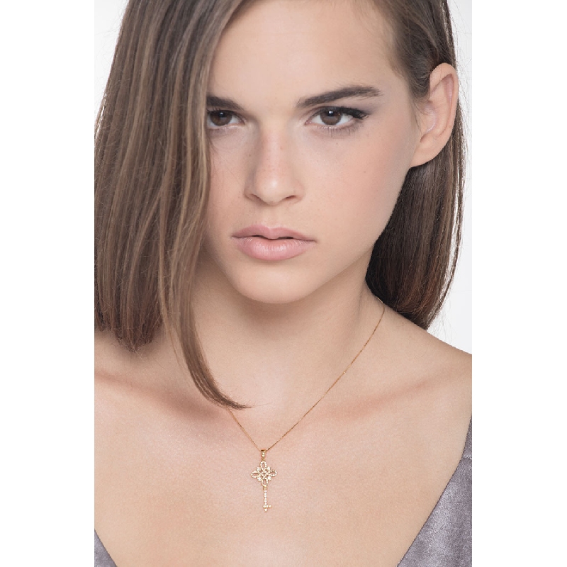 18k yellow gold key pendant with diamonds