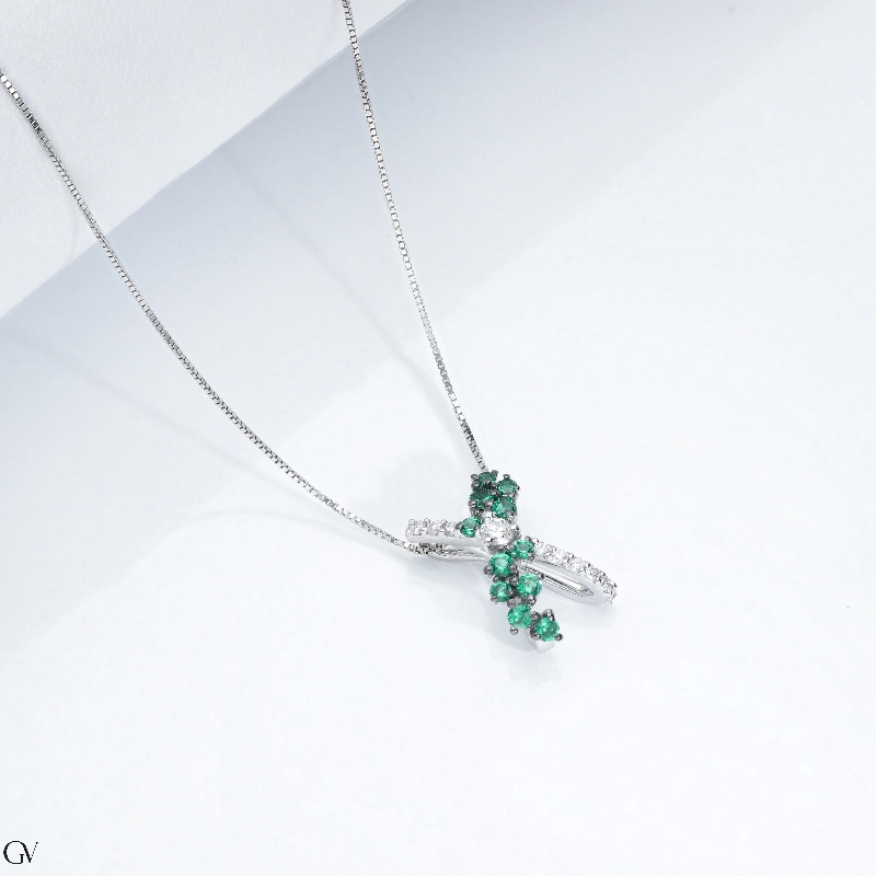 Necklace with fancy twisted pendant with emeralds and diamonds