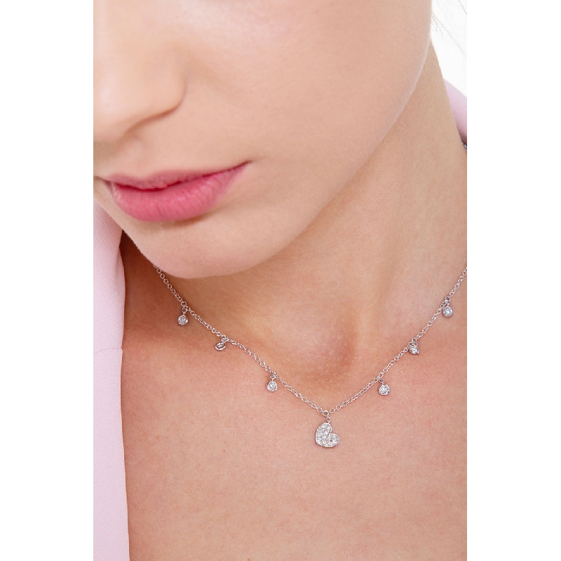 Necklace with 6 round cut diamonds and a heart pendant with diamonds