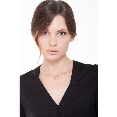 Necklace with 6 round cut diamonds and a four leaf clover pendant 