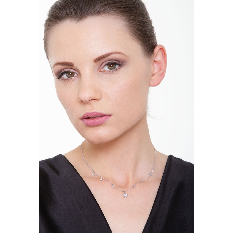 Necklace with a diamond star pendant and diamond charms