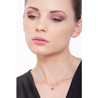 Necklace with 6 round cut diamonds and a star pendant with rubies