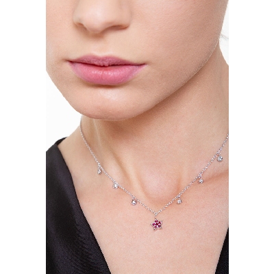 Necklace with 6 round cut diamonds and a star pendant with rubies
