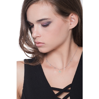 Necklace with 6 round cut diamonds and a star pendant with emeralds