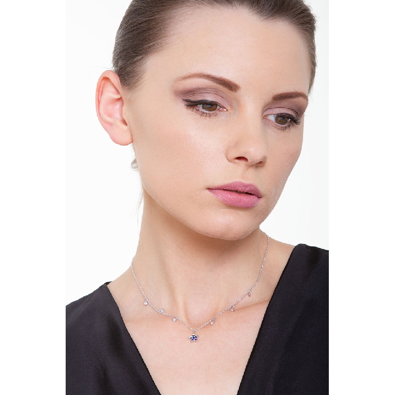 White gold 18k necklace with 6 round cut diamonds and a star shaped pendant with sapphires