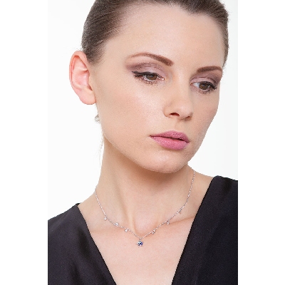 White gold 18k necklace with 6 round cut diamonds and a star shaped pendant with sapphires