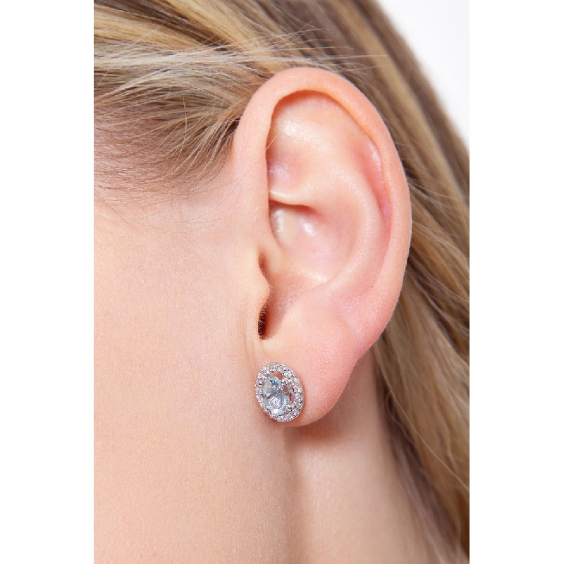 18k white gold halo stud earrings with aquamarine oval cut and diamonds 