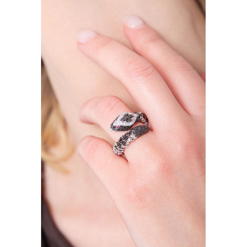 18k white gold snake ring with white and black diamonds and rubies