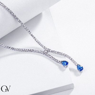 Diamond tennis necklace with 2 pear cut blue sapphires