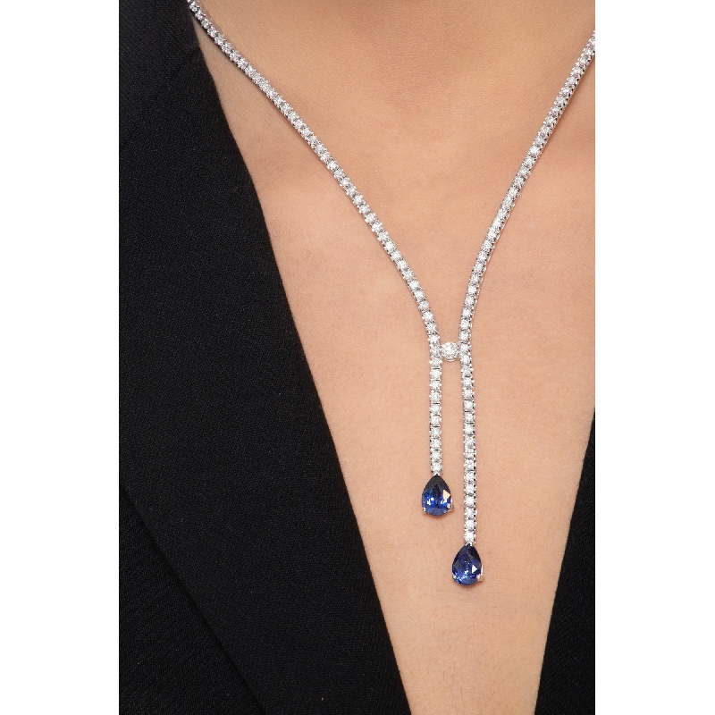 Diamond tennis necklace with 2 pear cut blue sapphires